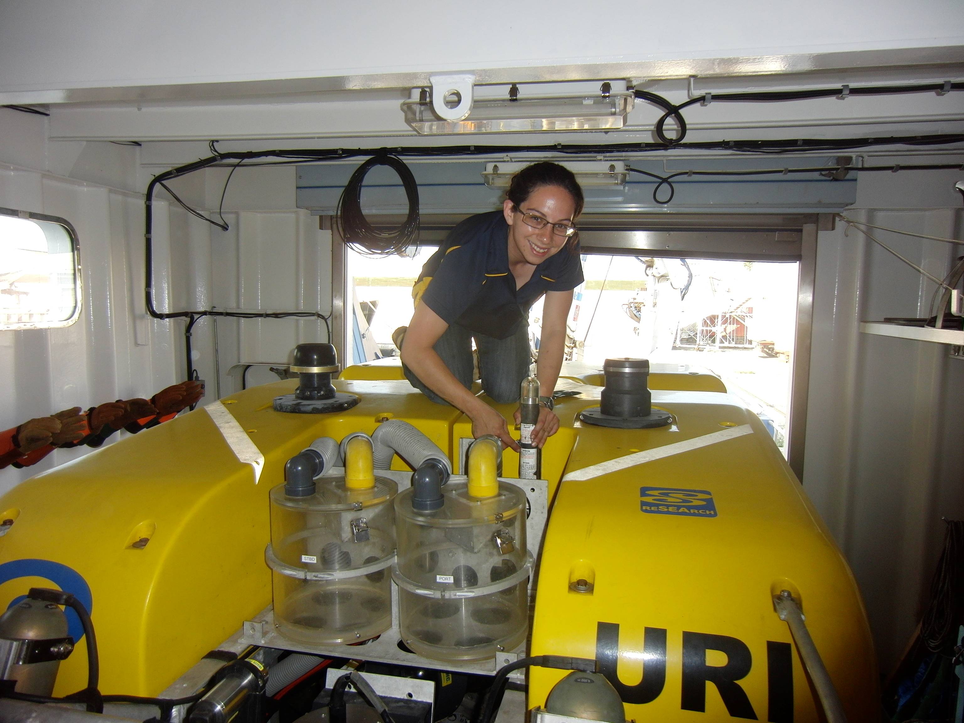 Rachel Gaines working on an ROV during her MATE Internship on the E/V Nautilus